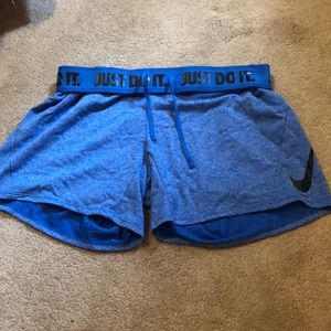Blue Nike shorts with draw string